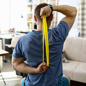 man stretching with exercise bands