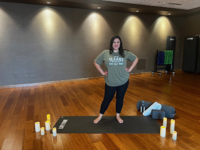 Jennifer posing on yoga mat