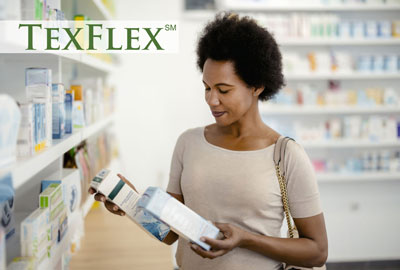 woman comparing two items at a pharmacy